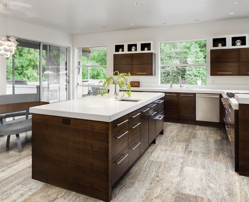Inspiration for a large contemporary l-shaped eat-in kitchen in Calgary with an undermount sink, flat-panel cabinets, dark wood cabinets, quartzite benchtops, stainless steel appliances, travertine floors, with island and beige floor.