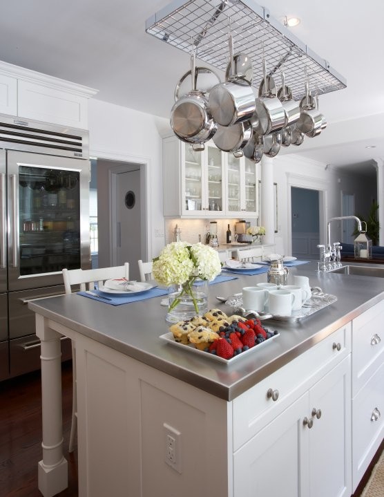 Eat-in kitchen - large transitional u-shaped dark wood floor eat-in kitchen idea with shaker cabinets, white cabinets, stainless steel countertops, white backsplash, stainless steel appliances and an island
