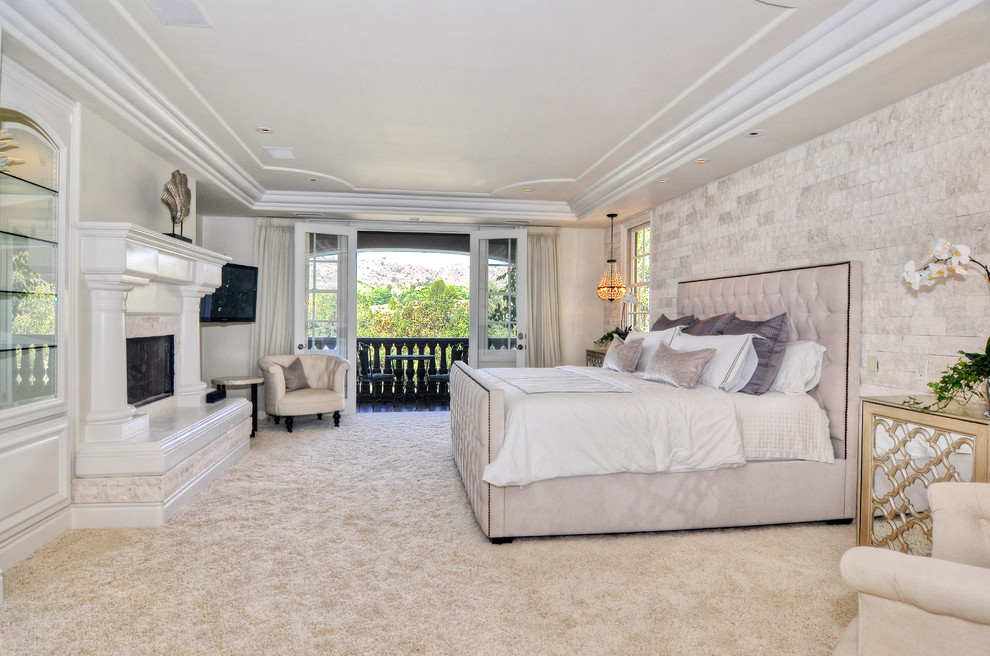 Design ideas for a transitional bedroom in Orange County with white walls and carpet.
