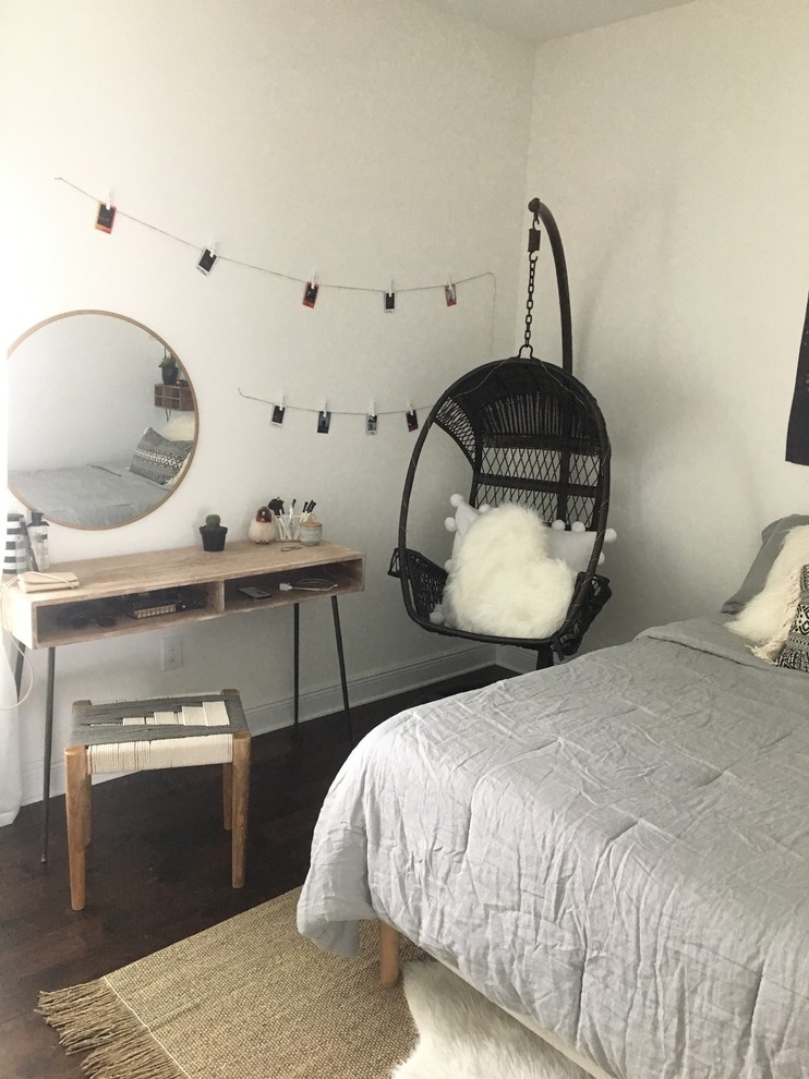 Photo of a mid-sized scandinavian guest bedroom in Tampa with white walls, dark hardwood floors, no fireplace and brown floor.