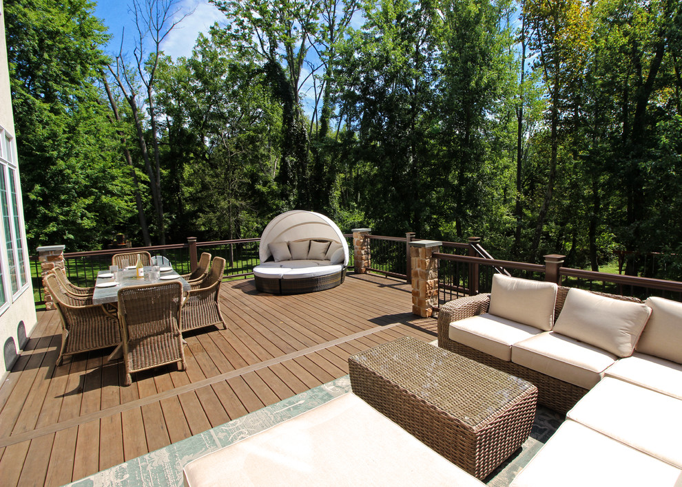 This is an example of a transitional backyard deck in Philadelphia with an outdoor kitchen.