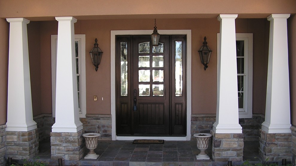 Front door - large rustic slate floor front door idea in Miami with brown walls and a dark wood front door