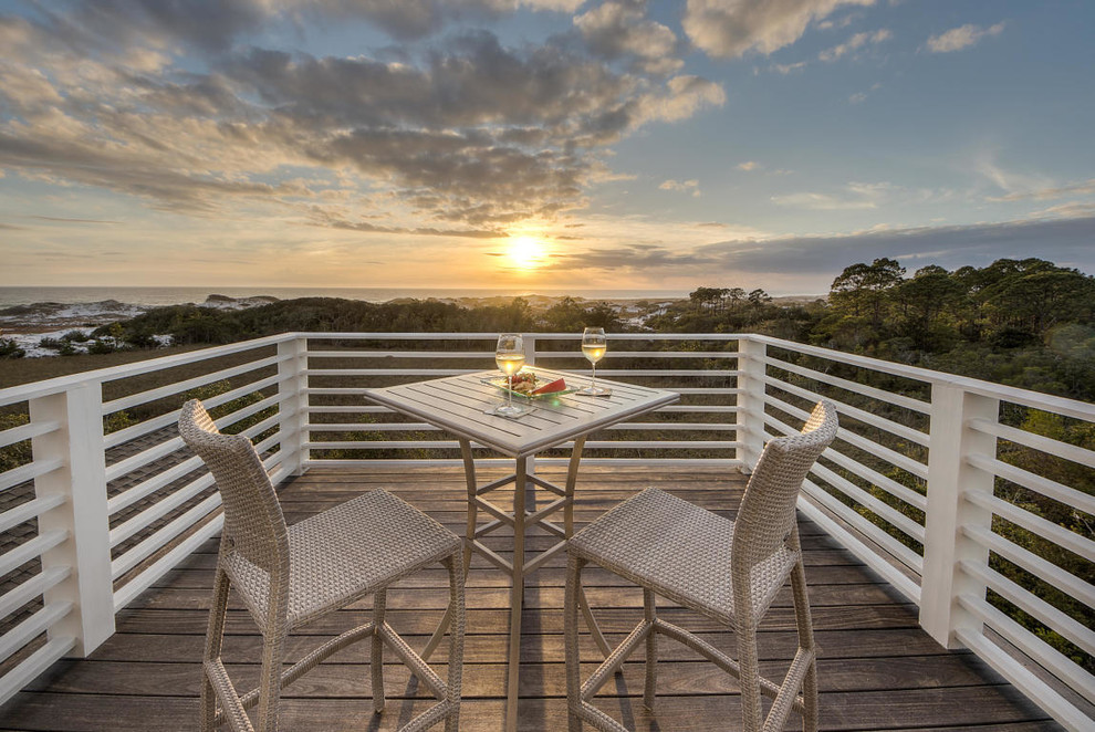 Inspiration for a huge shabby-chic style rooftop deck remodel with an awning