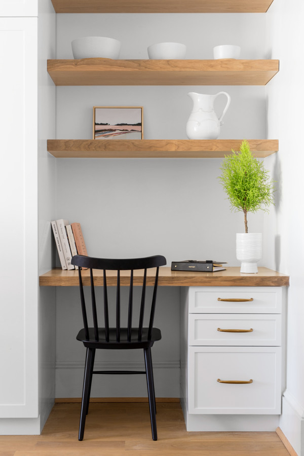 Mid-sized transitional single-wall medium tone wood floor and brown floor eat-in kitchen photo in Baltimore with white cabinets, white backsplash, an undermount sink, wood countertops and brown countertops