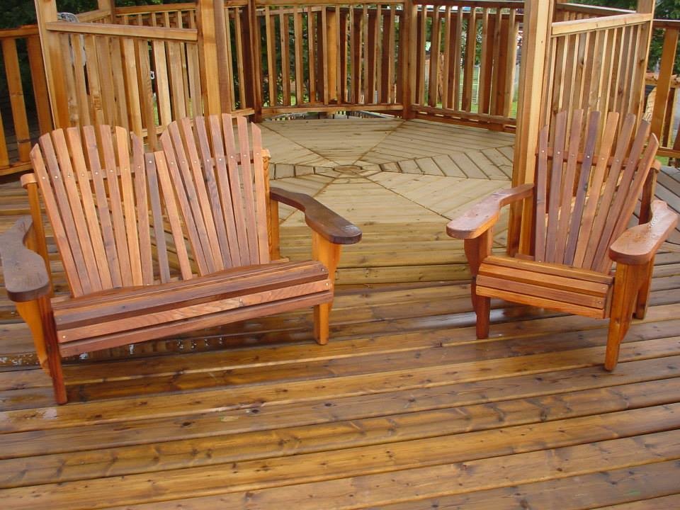 Large backyard deck photo in Vancouver with a pergola