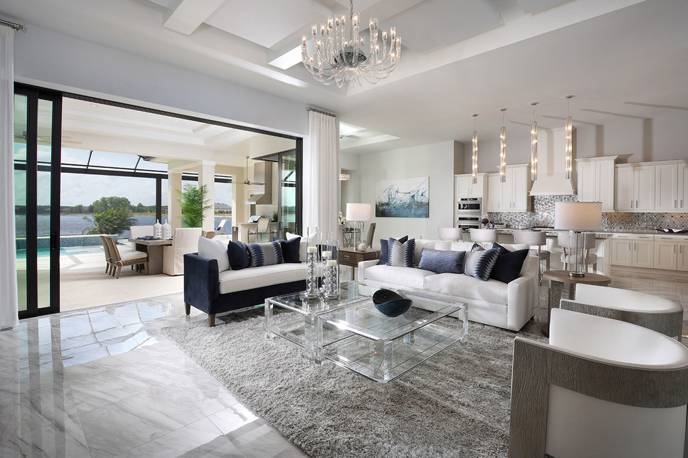 Mid-sized contemporary open concept living room in Other with grey walls, marble floors and grey floor.
