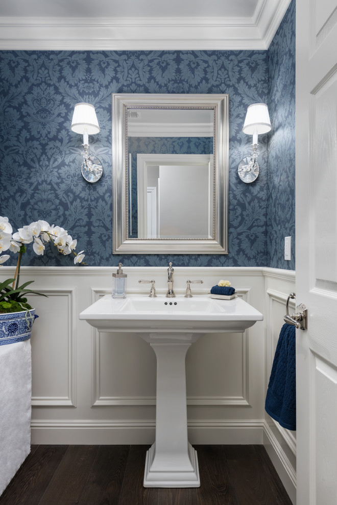 Photo of a traditional powder room in San Francisco with white walls, dark hardwood floors, a pedestal sink and brown floor.