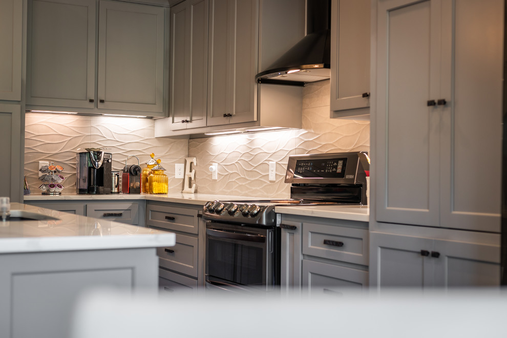 Example of a mid-sized transitional single-wall dark wood floor and brown floor open concept kitchen design in Raleigh with an undermount sink, shaker cabinets, gray cabinets, marble countertops, white backsplash, stainless steel appliances, an island and gray countertops
