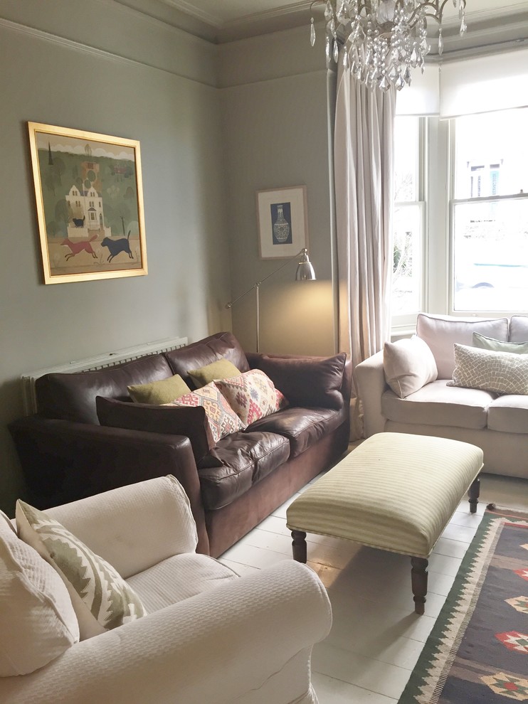 This is an example of a mid-sized eclectic open concept living room in London with grey walls.