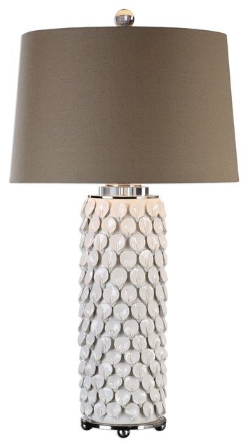 white ceramic lamp with flower on base