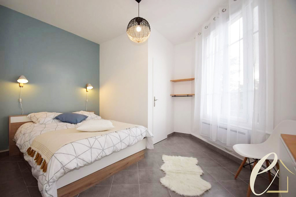 Design ideas for a large scandinavian master bedroom in Marseille with blue walls, terra-cotta floors and grey floor.