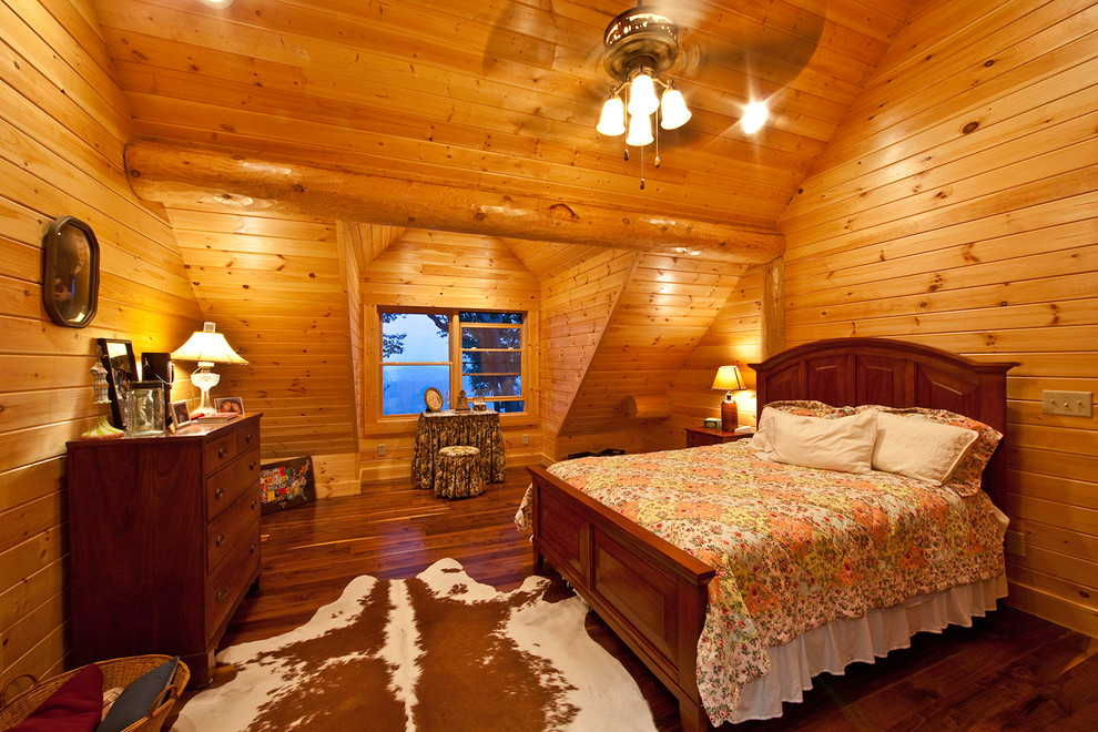 Design ideas for a country guest bedroom in Other with dark hardwood floors.