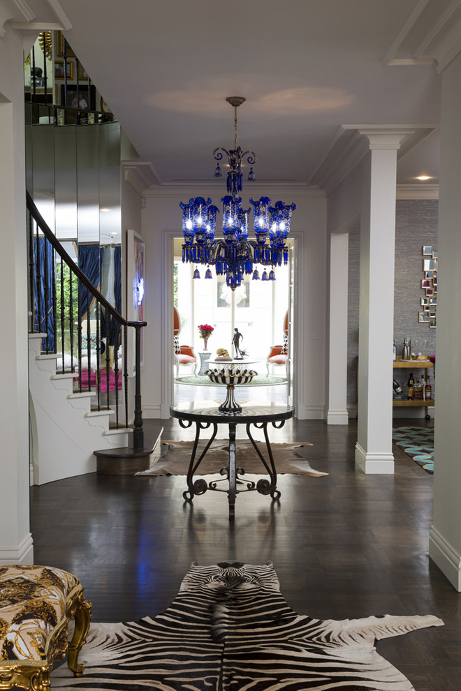 This is an example of a large eclectic hallway in Melbourne with white walls, dark hardwood floors and brown floor.