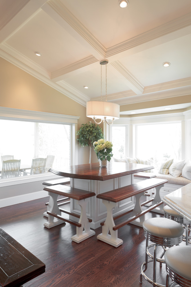 Inspiration for a traditional dining room in Salt Lake City with beige walls and dark hardwood floors.