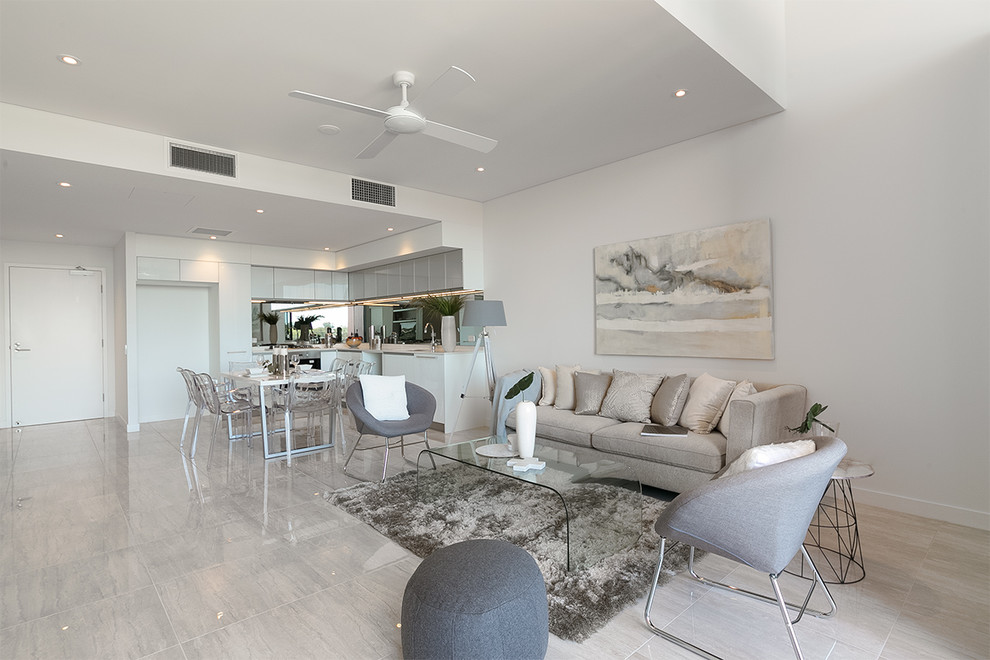 Photo of a contemporary open concept living room in Brisbane with white walls and light hardwood floors.