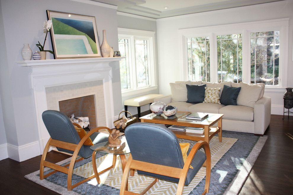 Large transitional enclosed living room in San Francisco with grey walls, medium hardwood floors, a standard fireplace, a tile fireplace surround and no tv.