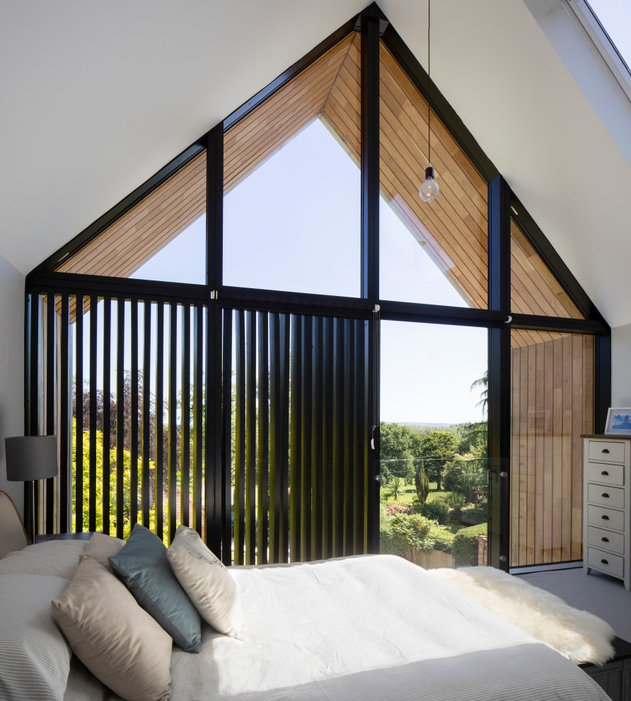 This is an example of a modern bedroom in Hampshire.