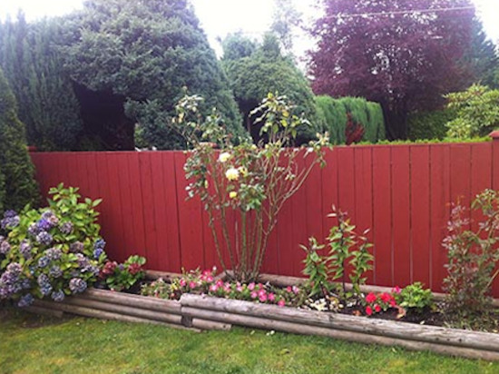 Design ideas for a mid-sized country backyard full sun garden for spring in Vancouver with mulch.