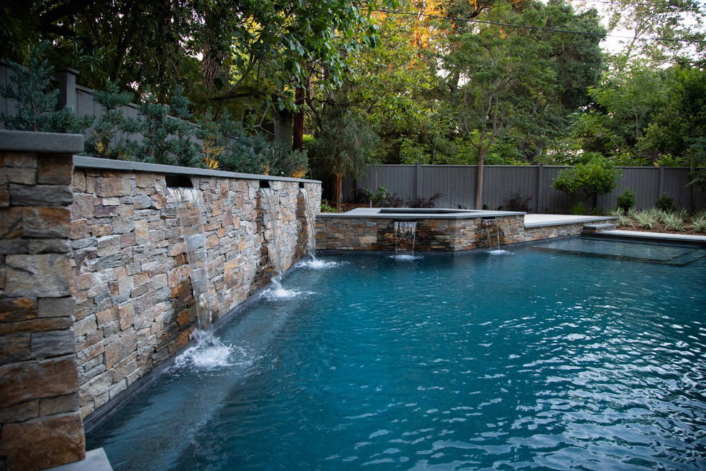 Inspiration for an arts and crafts backyard pool in Los Angeles with concrete slab.