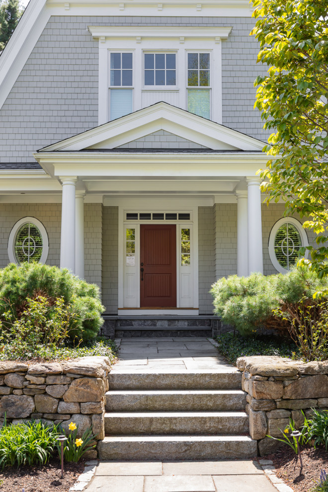 Mid-sized transitional beige two-story mixed siding and shingle house exterior photo in Boston with a shingle roof