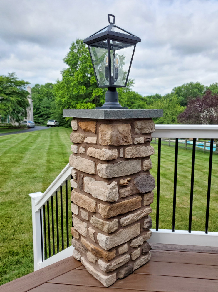 Mid-sized transitional backyard ground level mixed material railing deck photo