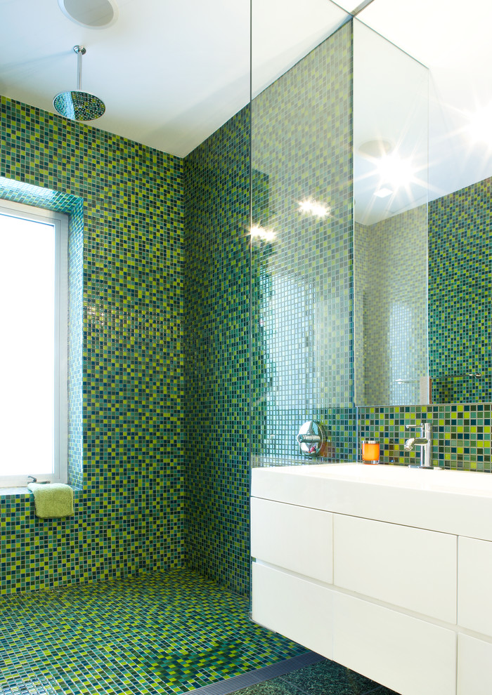 Inspiration for a mid-sized contemporary kids bathroom in New York with flat-panel cabinets, white cabinets, mosaic tile floors, green floor, an open shower, a curbless shower, green tile, mosaic tile and a console sink.