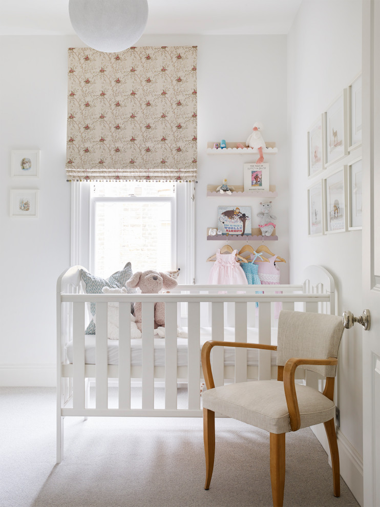 This is an example of a classic nursery in London with feature lighting.