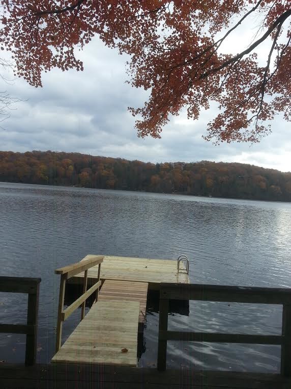 Example of a mountain style backyard dock design in New York