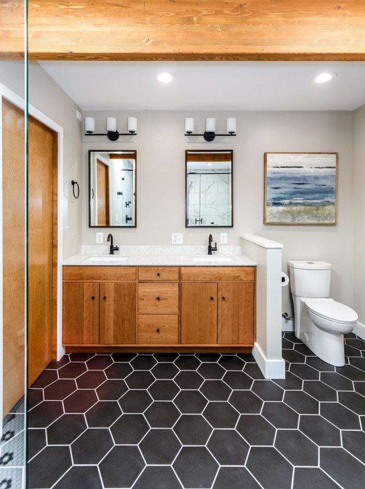 Mid-sized transitional master bathroom in Seattle with flat-panel cabinets, medium wood cabinets, an alcove tub, a two-piece toilet, black and white tile, porcelain tile, grey walls, porcelain floors, an undermount sink, engineered quartz benchtops, black floor, white benchtops, a double vanity and a built-in vanity.