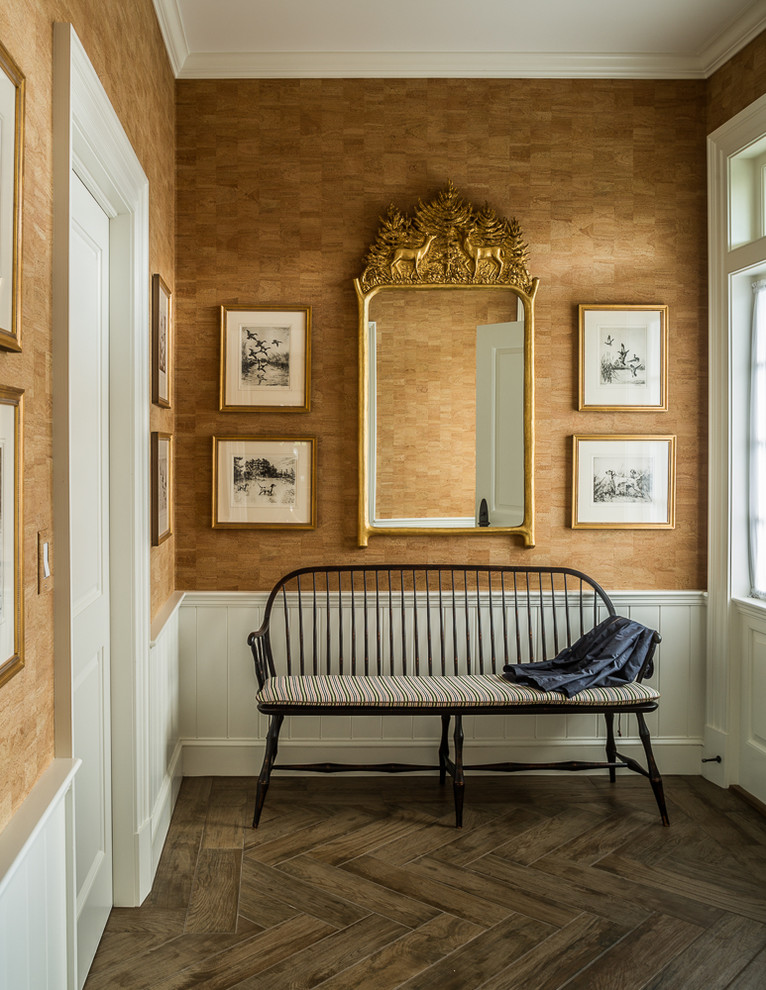 Photo of a large traditional hallway in Portland Maine with brown walls, dark hardwood floors and brown floor.