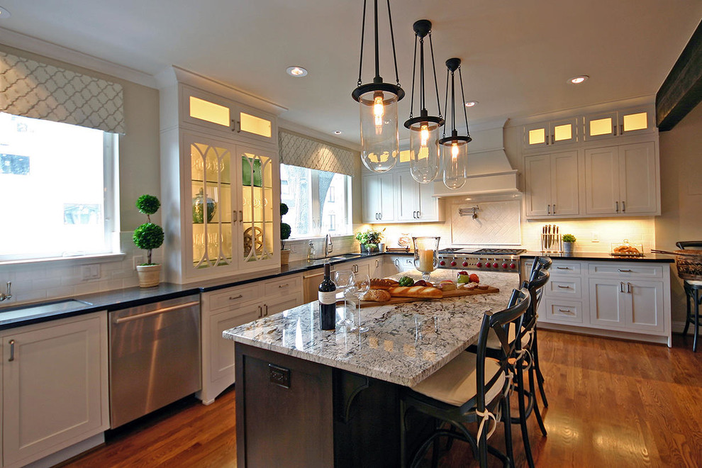 Kitchen - large transitional medium tone wood floor kitchen idea in Houston with an undermount sink, recessed-panel cabinets and an island