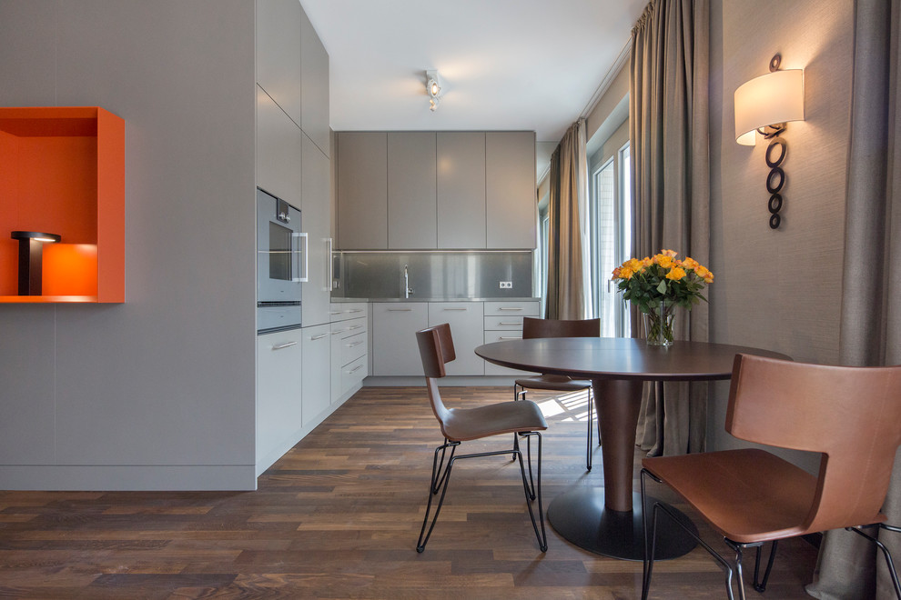 Design ideas for a large contemporary open plan dining in Berlin with dark hardwood floors.