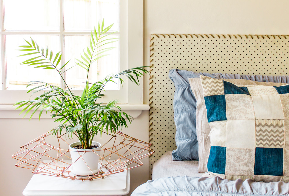 Design ideas for a mid-sized modern bedroom in Brisbane with white walls.