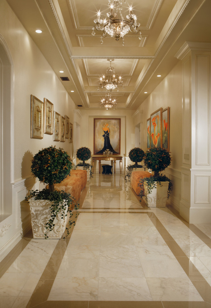 Design ideas for an expansive traditional hallway in Phoenix with white walls, marble floors and beige floor.