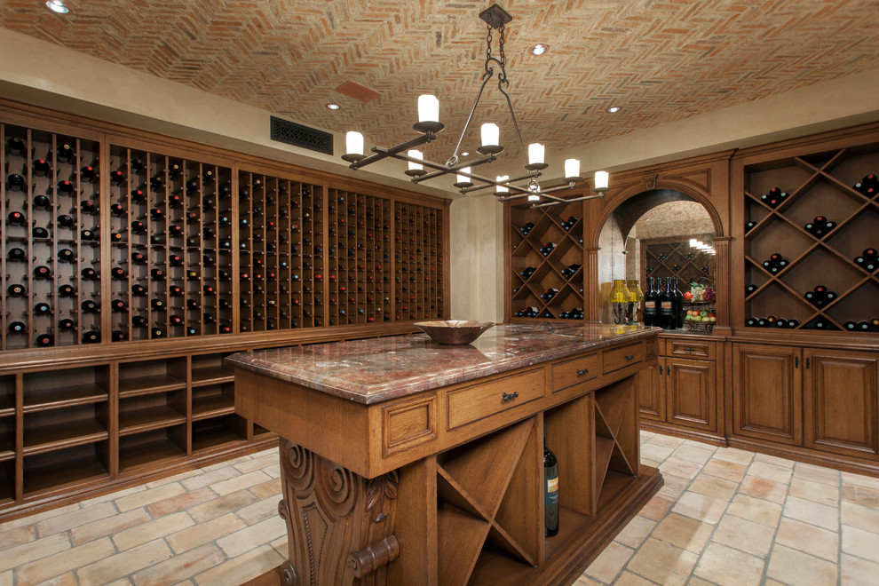Design ideas for a mediterranean wine cellar in Orange County with beige floor and storage racks.