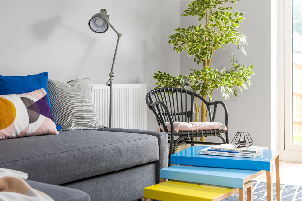 This is an example of a small bohemian living room in Other with grey walls.