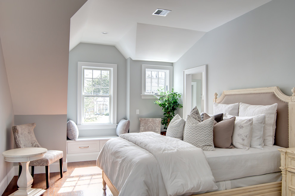 Design ideas for an expansive traditional master bedroom in Boston with grey walls, dark hardwood floors, a ribbon fireplace, a stone fireplace surround and beige floor.