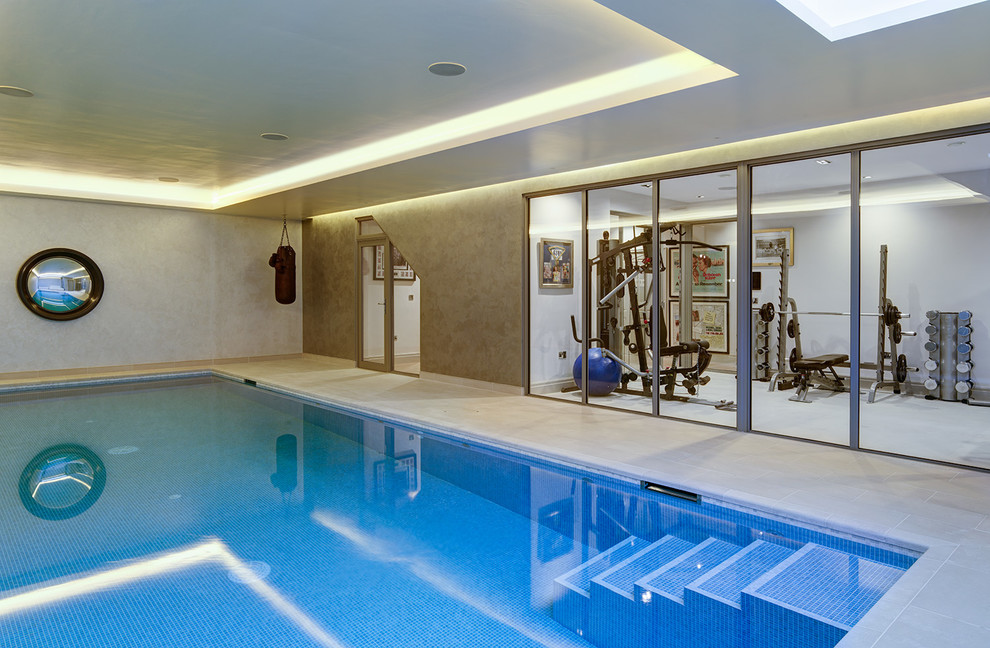 This is an example of a contemporary indoor rectangular pool in Kent.
