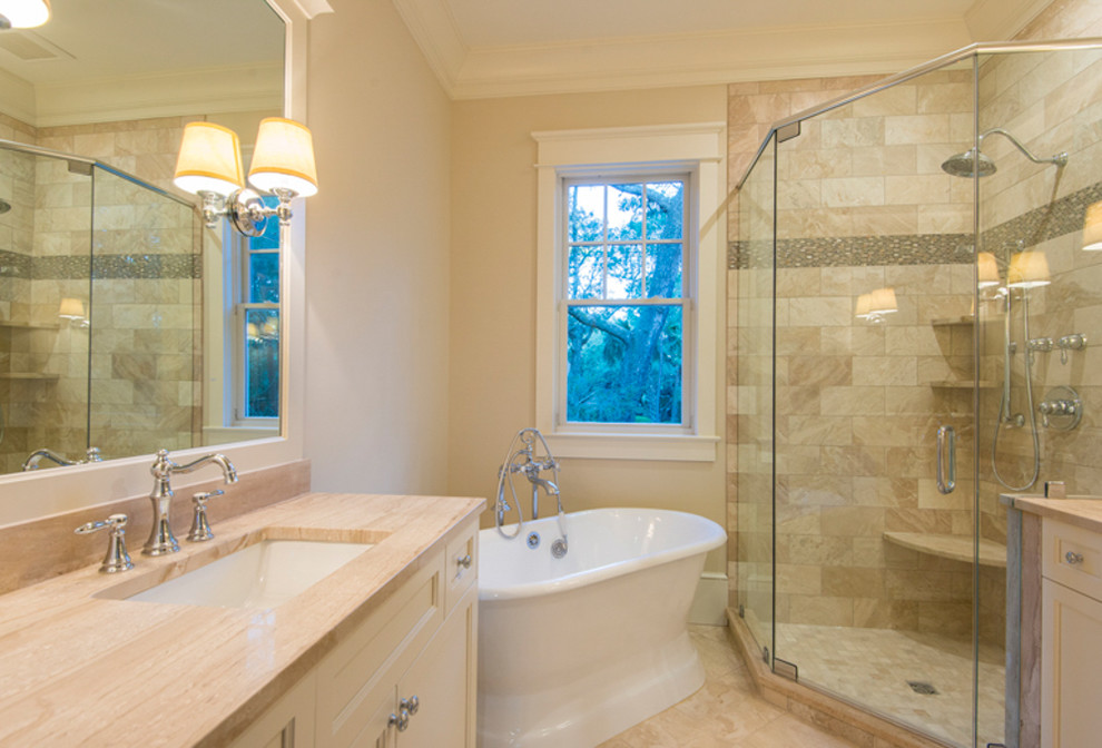This is an example of a small transitional master bathroom in Charleston with recessed-panel cabinets, beige cabinets, a freestanding tub, a corner shower, beige tile, porcelain tile, beige walls, marble floors, an undermount sink, engineered quartz benchtops, beige floor, a hinged shower door, beige benchtops, a single vanity and a built-in vanity.