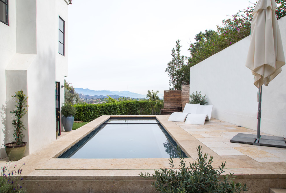 Pool - mediterranean rectangular pool idea in Los Angeles