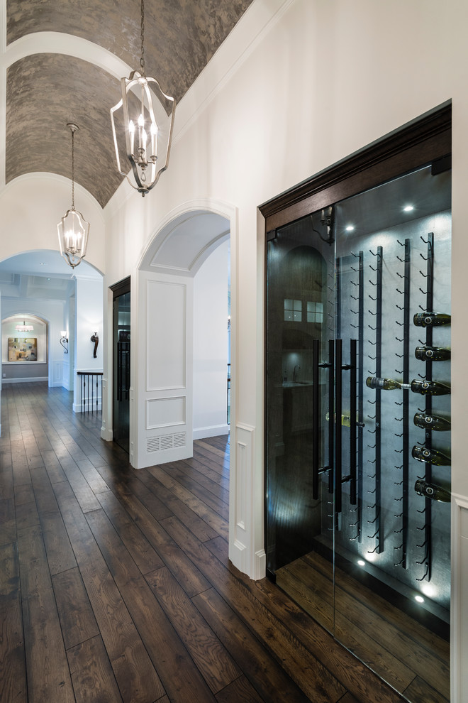 Huge mountain style medium tone wood floor and brown floor hallway photo in Vancouver with white walls