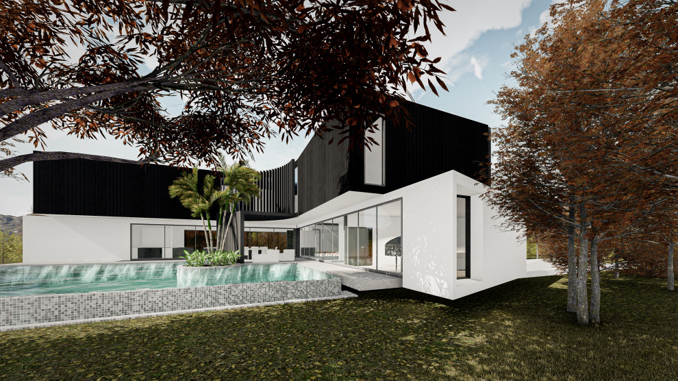 Idées déco pour une grande façade de maison multicolore contemporaine en pierre et planches et couvre-joints à un étage avec un toit plat, un toit en métal et un toit noir.