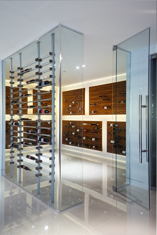 Photo of a large modern wine cellar in Vancouver with porcelain floors, diamond bins and white floor.