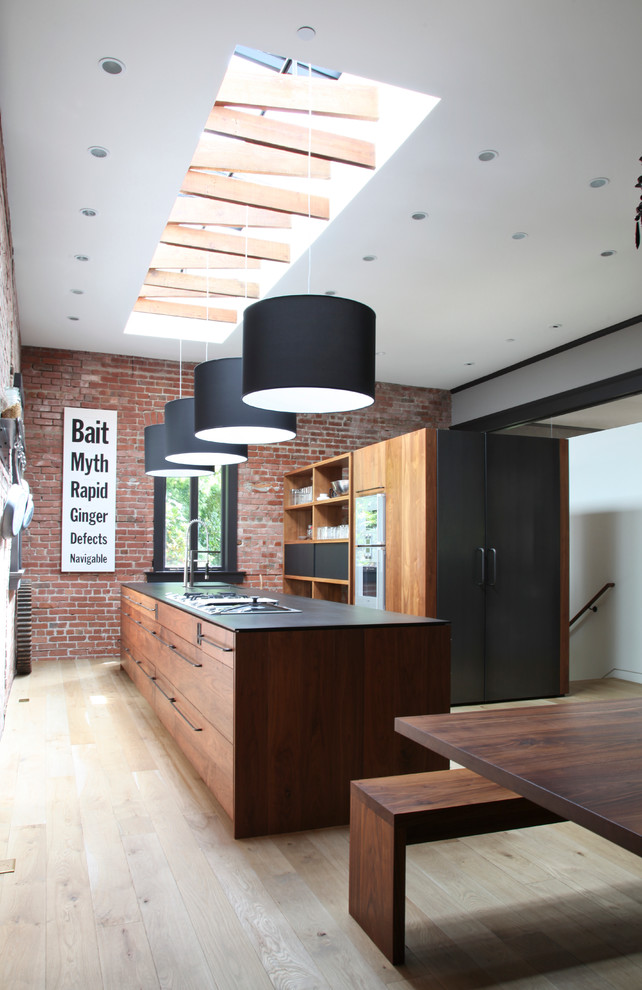 Contemporary galley kitchen in San Francisco with flat-panel cabinets and medium wood cabinets.
