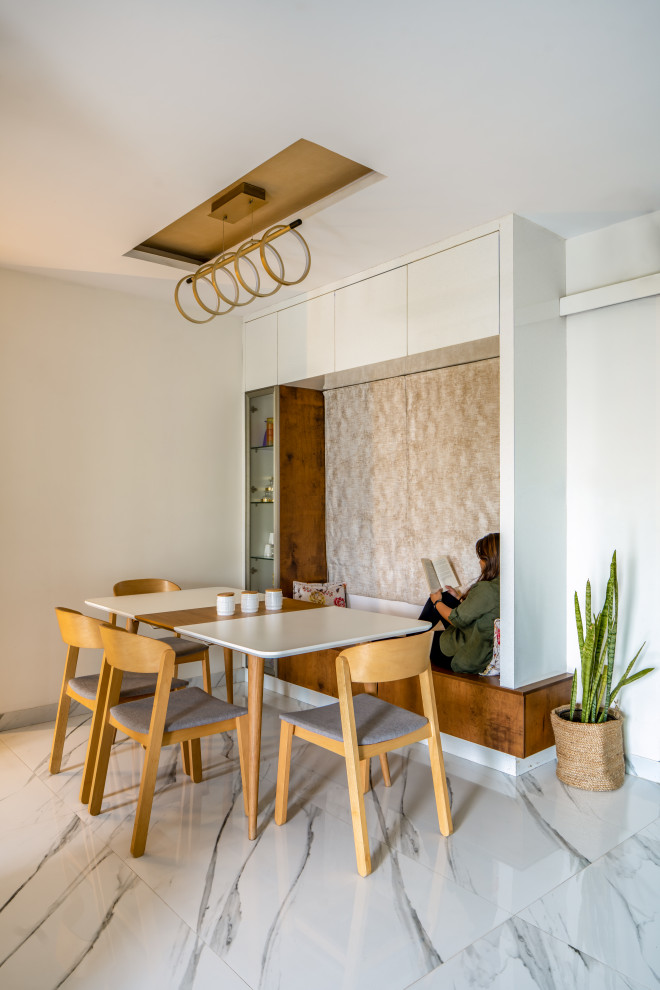 Dining room - contemporary dining room idea in Bengaluru