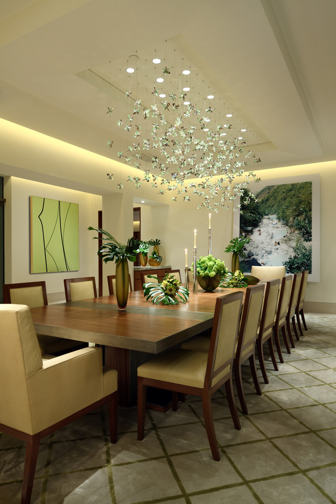 Inspiration for a contemporary dining room in Los Angeles with white walls, limestone floors and no fireplace.