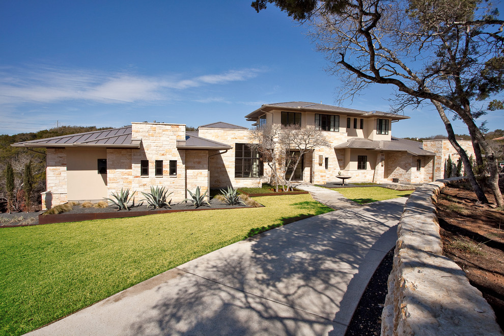 Inspiration for a contemporary exterior in Austin with stone veneer and a hip roof.