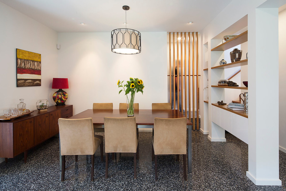 Design ideas for a contemporary open plan dining in Brisbane with white walls and concrete floors.