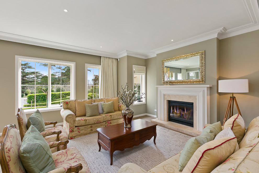 This is an example of a mid-sized contemporary formal enclosed living room in Sydney with beige walls, carpet, a standard fireplace and a tile fireplace surround.