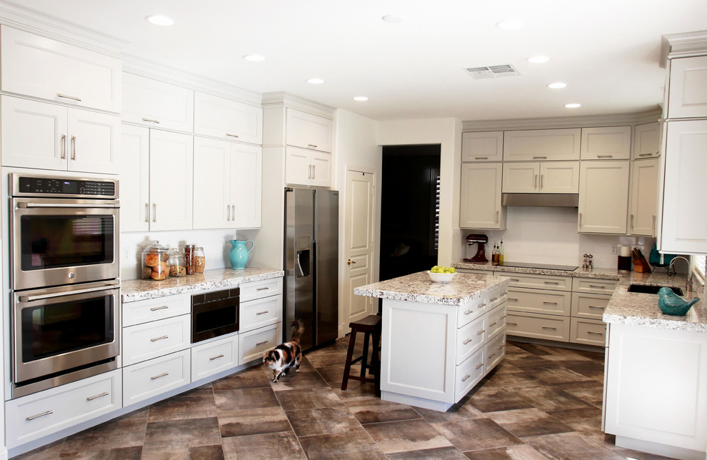Inspiration for a mid-sized transitional u-shaped porcelain tile and gray floor eat-in kitchen remodel in Phoenix with a double-bowl sink, shaker cabinets, gray cabinets, granite countertops, white backsplash, subway tile backsplash, stainless steel appliances, an island and white countertops